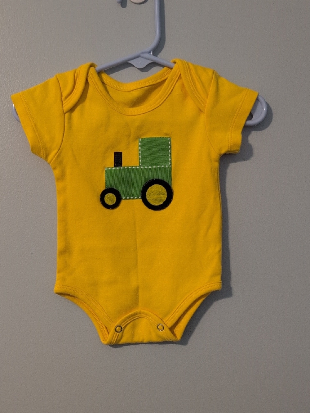Yellow Baby Onesie with Green Tractor Applique